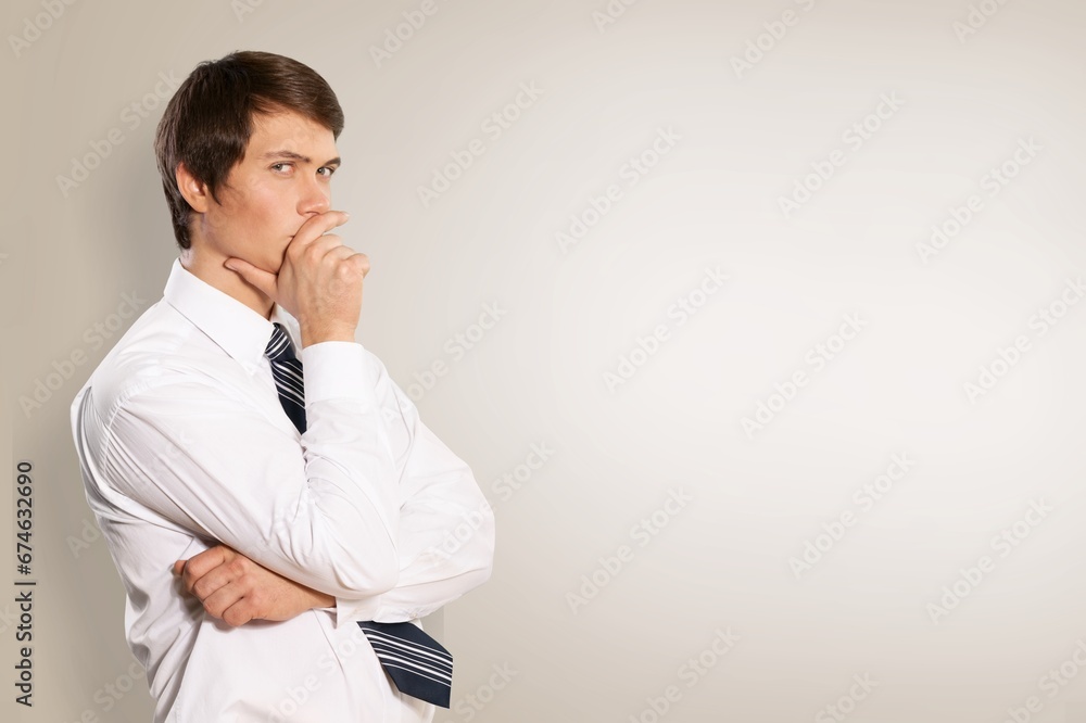 Happy handsome businessman posing on background Happy handsome businessman posing on background