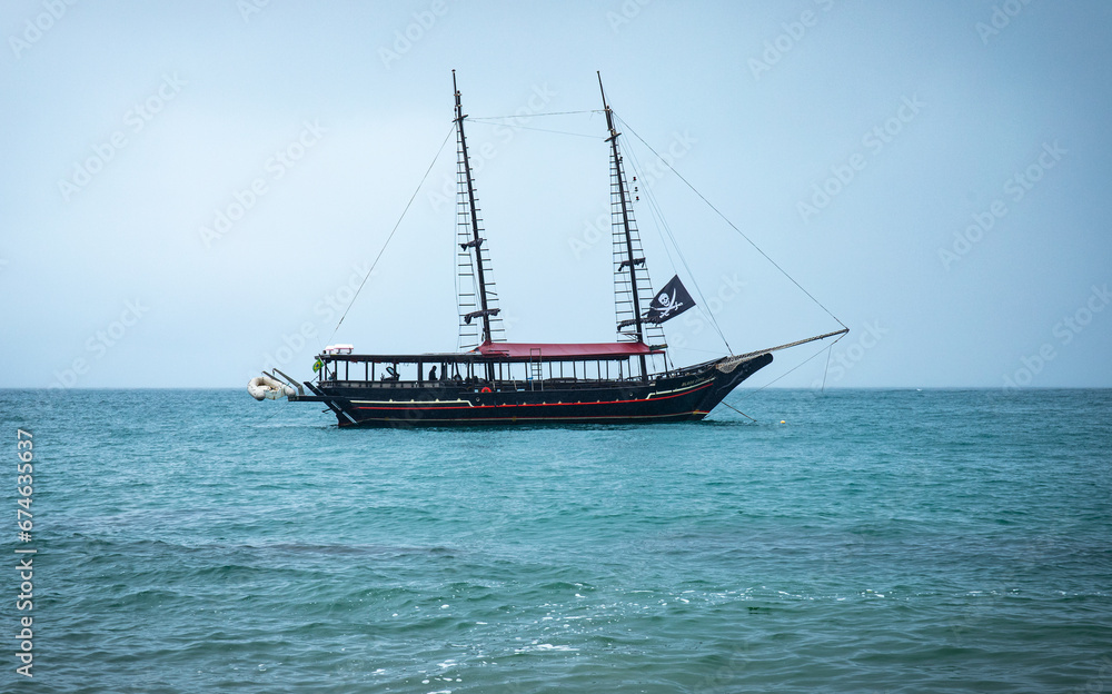 Pirate ship on the high seas, horizontal landscape photo, Tour boat, Piracy on the beach. Brazilian Sea, Ilha Bela. Calm sea. Pirate ship on the high seas, horizontal landscape photo, Tour boat, Piracy on the beach. Brazilian Sea, Ilha Bela. Calm sea.