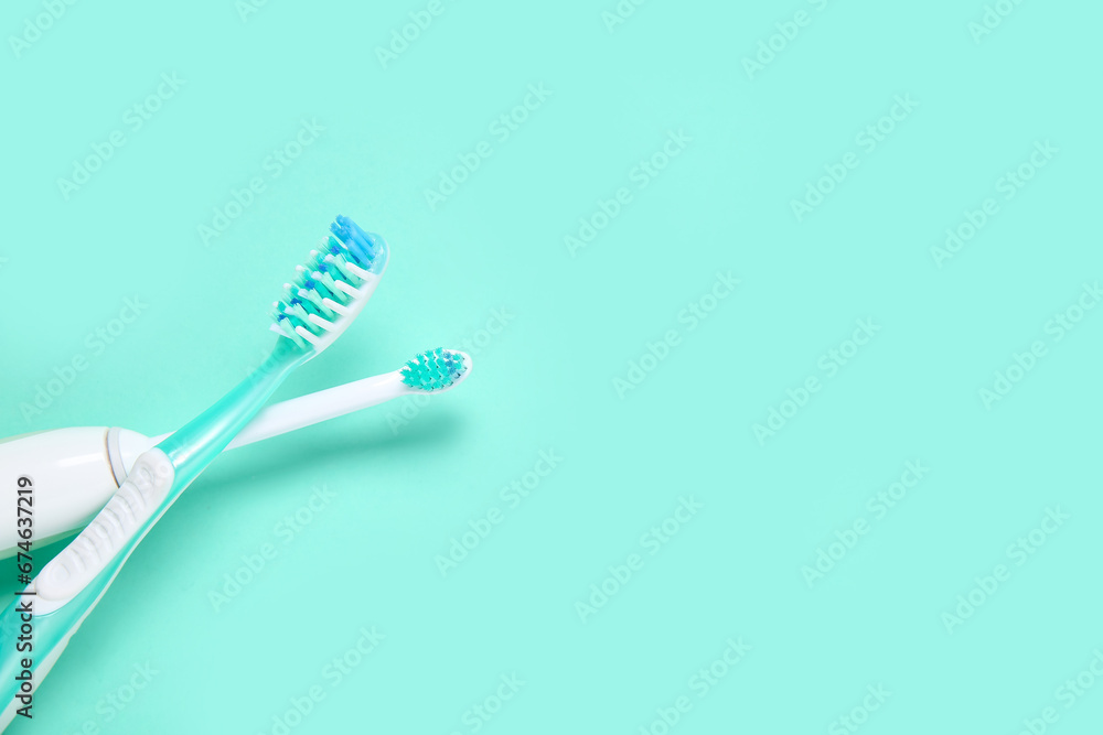 Electric and plastic toothbrushes on color background. Electric and plastic toothbrushes on color background.