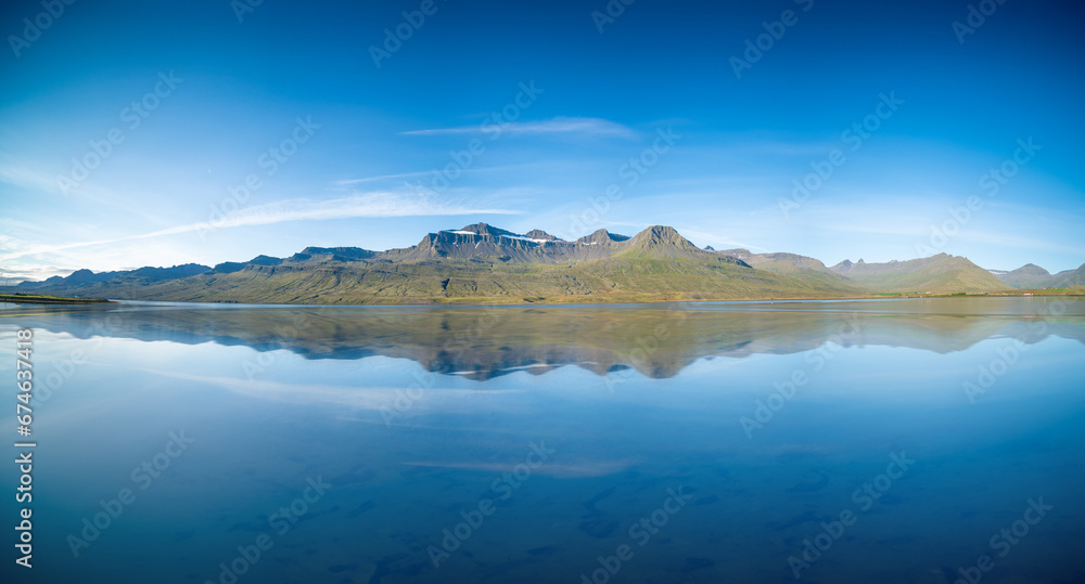 mountain range reflected in a calm mountain lake