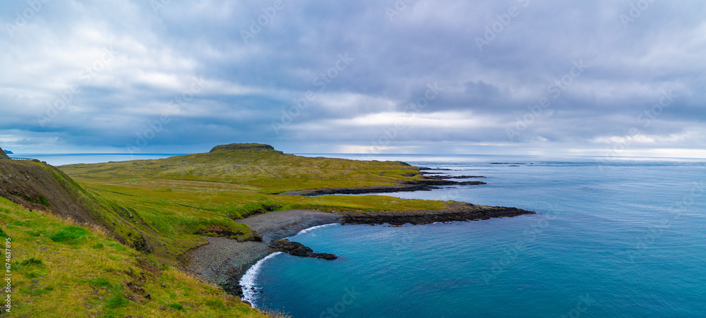 Tranquil shoreline with peaceful ocean and scenic horizon.