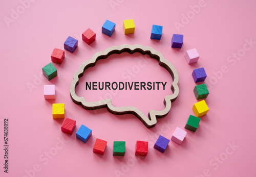 The outline of brain with the inscription neurodiversity is surrounded by colored cubes. photo
