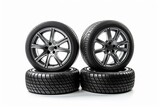 A set of car tires and wheels isolated on a white background