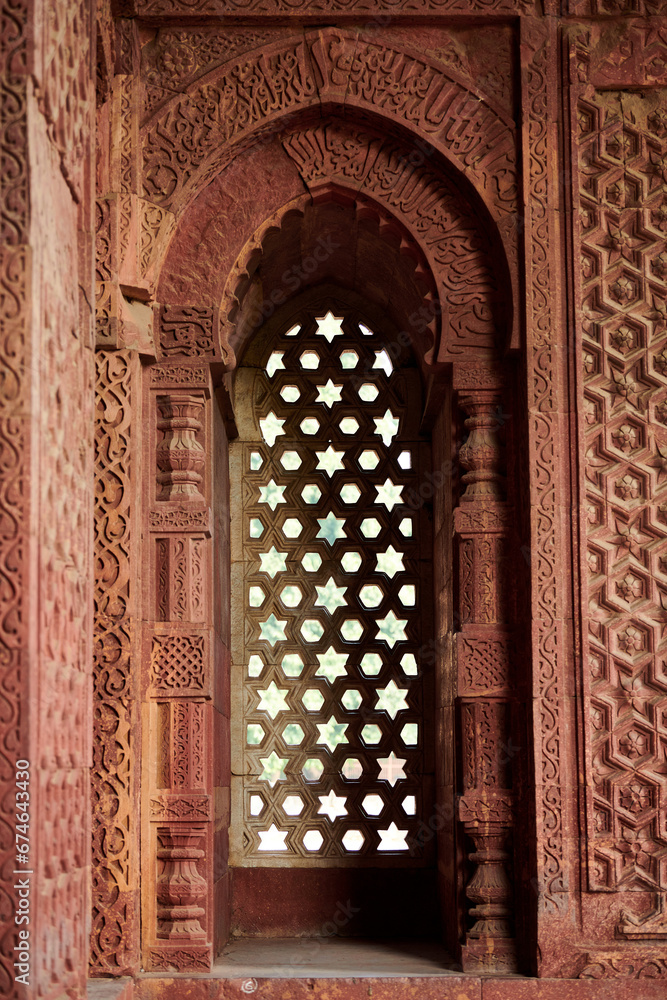Decorative window shutters of Alai Darwaza landmark part of Qutb complex in South Delhi, India,