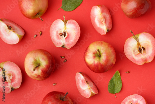 Fototapeta Naklejka Na Ścianę i Meble -  Sweet pink apples and seeds on red background