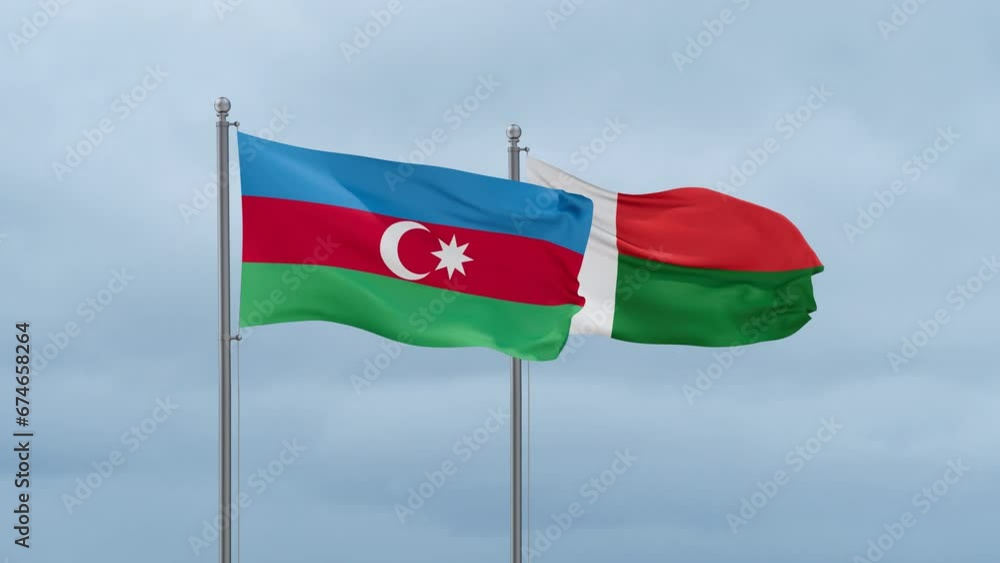 Madagascar flag and Azerbaijan flag waving together on cloudy sky, endless seamless loop, two country relations concept Madagascar flag and Azerbaijan flag waving together on cloudy sky, endless seamless loop, two country relations concept