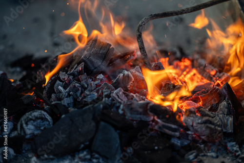 Close up of bonfire with flame and firewood outdoors