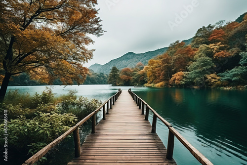 a wooden path to calm lake, landscape nature photo, minimal wallpaper © Uwe