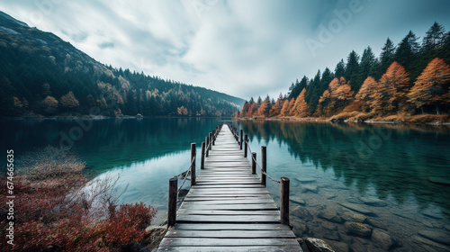 a wooden path to calm lake, landscape nature photo, minimal wallpaper © Uwe