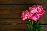 flowers peonies on wooden background holiday