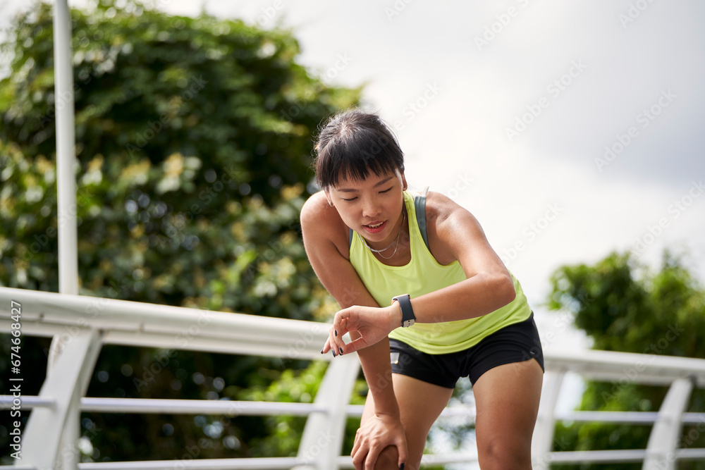 young asian woman female athlete exercising outdoors