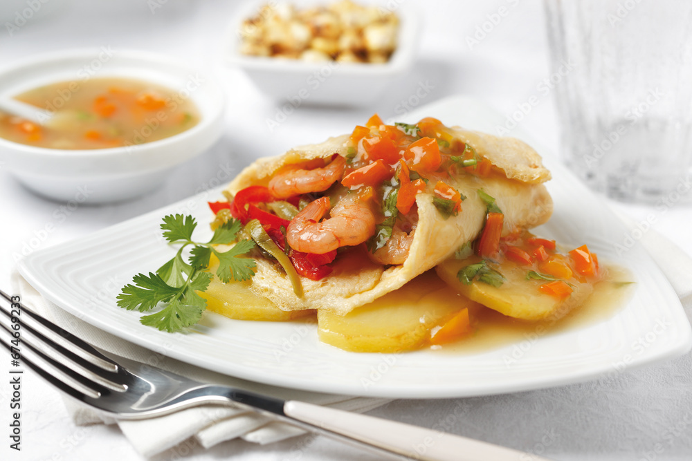 Creamy Omelet with Shrimp, vegetables and cooked potatoes. Easy lunch or breakfast. Side view Creamy Omelet with Shrimp, vegetables and cooked potatoes. Easy lunch or breakfast. Side view