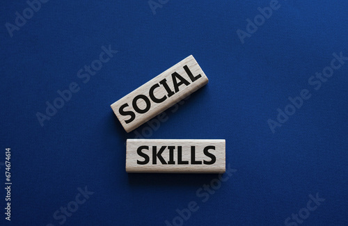 Social skills symbol. Wooden blocks with words Social skills Beautiful deep blue background. Business and Social skills concept. Copy space.