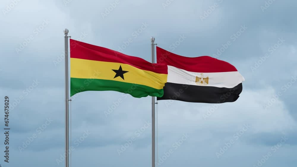 Egypt flag and Ghana flag waving together on cloudy sky, endless seamless loop, two country relations concept Egypt flag and Ghana flag waving together on cloudy sky, endless seamless loop, two country relations concept