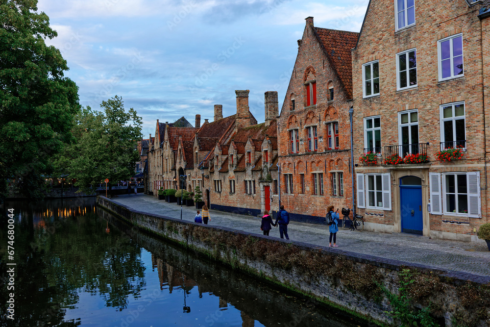 Bruges Belgium - 08 01 2023: Historic city center of Brugge, West Flanders province. Ancient medieval architecture of Bruges old town. Canals and stone paving streets cityscape with famous Burg Berg