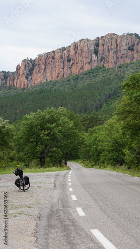 A bicycle next to a road in the Esterel mountains in and around the Gorges du Blavet and Bagnols-en-Forêt in the region Provence-Alpes-Côte d’Azur in France, in the month of June