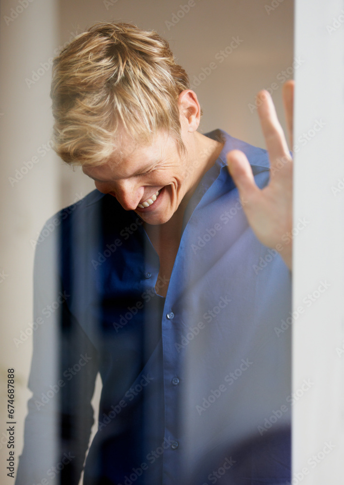 Smile, fashion and a man laughing while getting ready for an event behind transparent glass in his home. Clothes, luxury and funny with a happy young person dressing or thinking of memory in a hotel