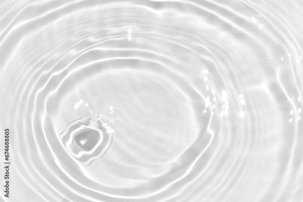 Defocus blurred transparent white colored clear calm water surface texture with splashes reflection. Trendy abstract nature background. Water waves in sunlight with copy space. Blue watercolor shine. Defocus blurred transparent white colored clear calm water surface texture with splashes reflection. Trendy abstract nature background. Water waves in sunlight with copy space. Blue watercolor shine.
