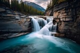 A panoramic shot of a waterfall in the Canadian Rockies.