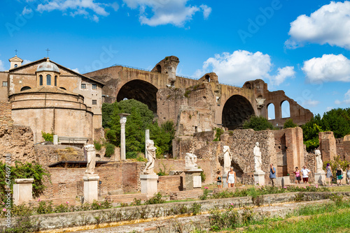 Monuments of the Roman Forum with the statues of the high priestesses of Vesta and the Basilica of Maxentius and Constantine. Rome, Italy photo