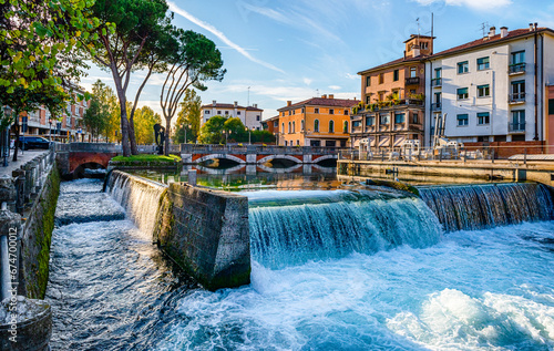 Evening view of the San Martino bridge. Italian city of Treviso in the province of Veneto. View of the river Sile and the architecture of Treviso Italy. Venetian architecture in Treviso, Italy.