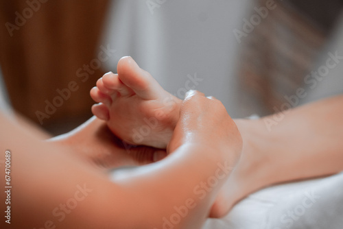 foot massage in spa  soft focus image