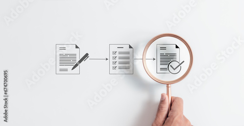 Magnifying glass focus to Approve document icon on white background for business process workflow illustrating management approval and and project approve concept. photo