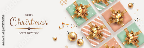 Horizontal banner with gold Christmas symbols and text. Christmas gifts, balls, decoration and other festive elements on light background.
