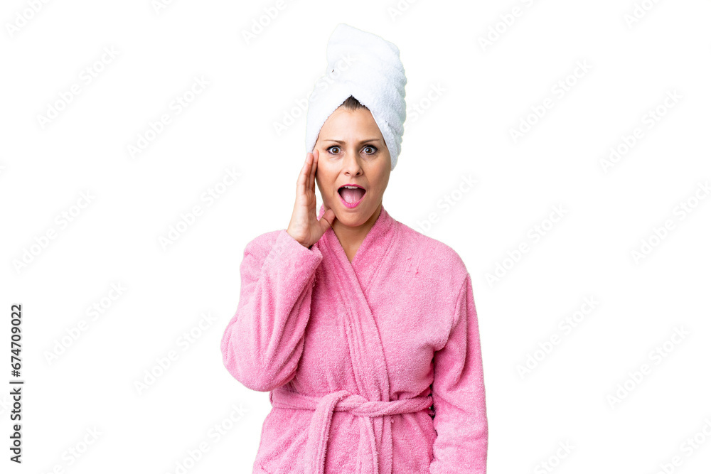 Middle age caucasian woman in a bathrobe over isolated background with surprise and shocked facial expression Middle age caucasian woman in a bathrobe over isolated background with surprise and shocked facial expression