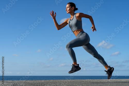 athletic brunette girl doing fitness doing exercises leading a healthy lifestyle