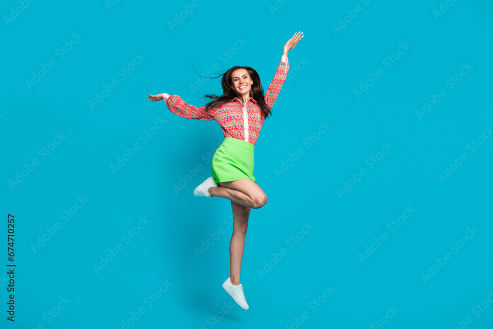 Full length photo of overjoyed glad girl dressed stylish clothes raise hands celebrate success win victory isolated on cyan color background