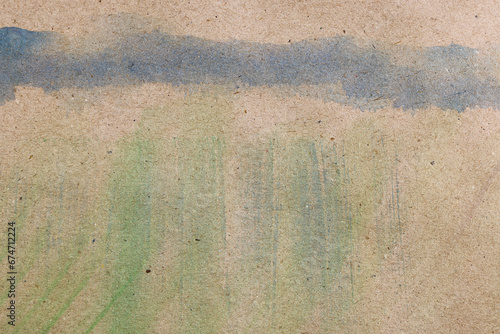 Fondo astratto: pennellate di acquerello verde e blu su carta colore avana, spazio per testo