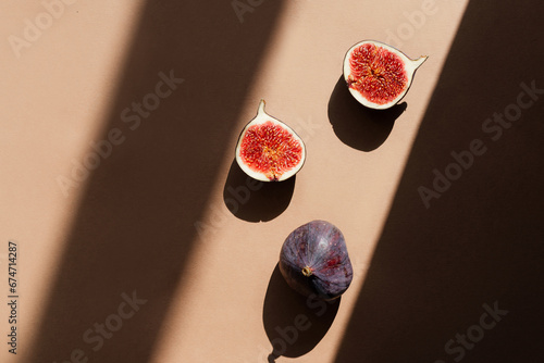 Still life with figs. Photos in natural colors. Minimal food concept with dramatic light and shadow