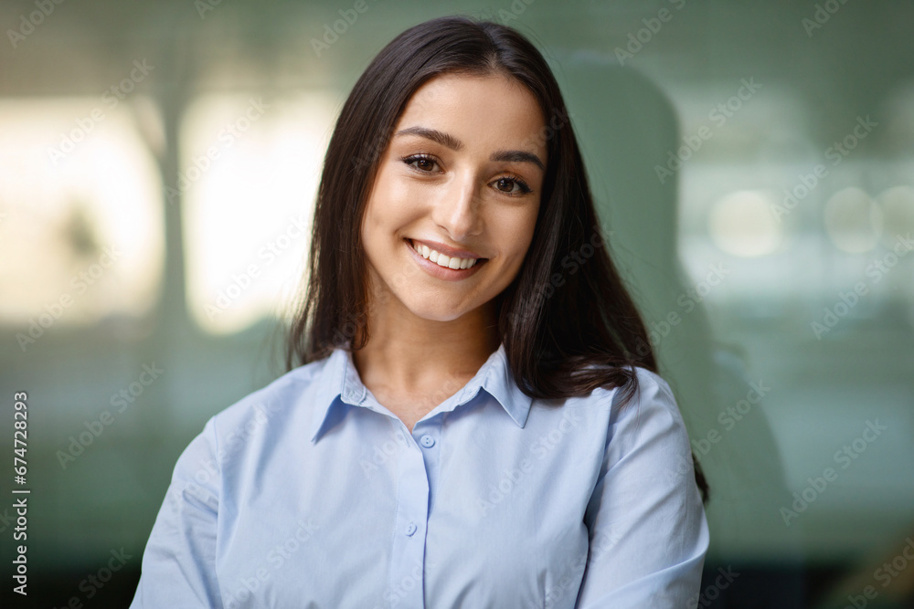 Fototapeta premium Happy pretty confident millennial businesswoman manager in suit enjoy work in city outdoors