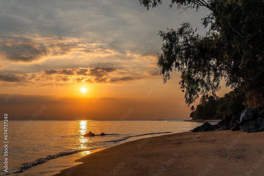 Sunset on the beach. Paradise beach. Tropical paradise.