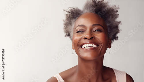 Smiling black adult woman with smooth healthy skin. Open healthy smiling beautiful aging mature woman with white teeth. Beauty, dental and cosmetics skincare advertising concept. AI generated