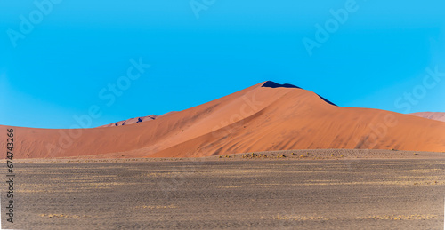 A view of a large sand dunes in the early morning light in Sossusvlei, Namibia in the dry season