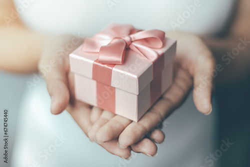 Romantic gift box 2024, Females holding Christmas gift box decorated with Christmas and New Year banner Concept merry christmas and happy new year 2024 © Urupong