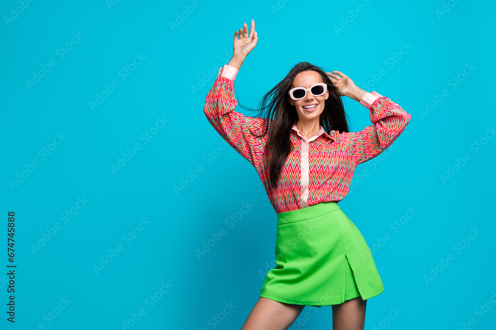 Photo of fashion model lady dancing at discotheque wearing sunglass summer clothes isolated teal blue color background