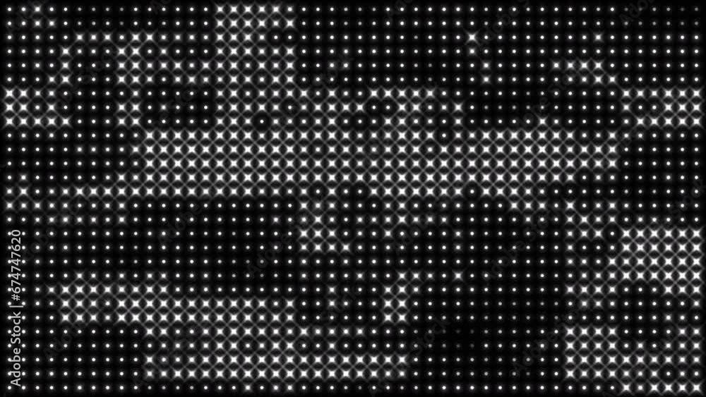Glowing bright white dot patterns on a black background Glowing bright white dot patterns on a black background