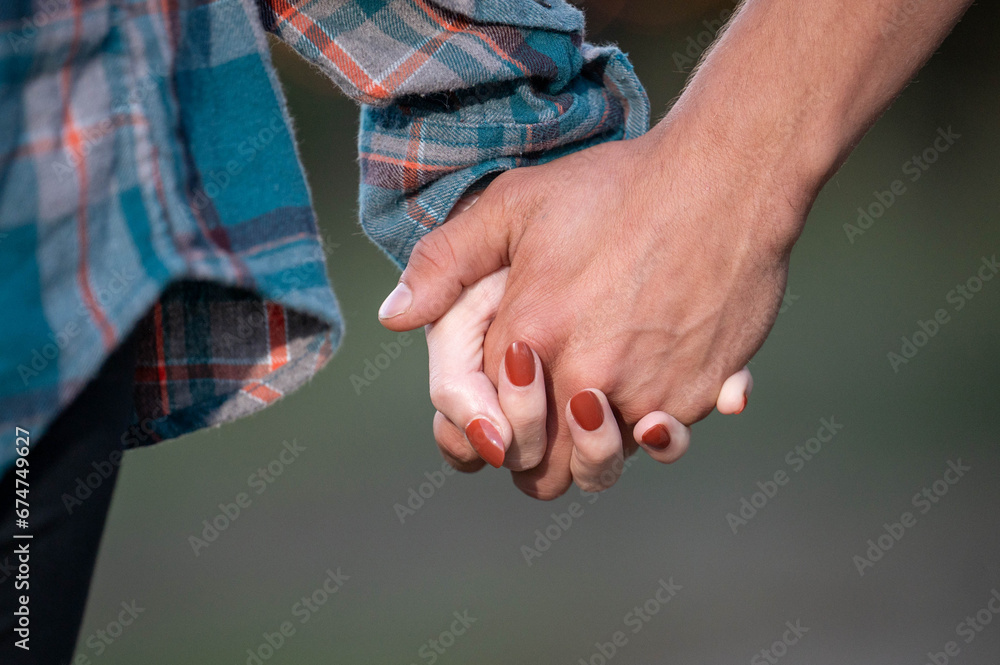 couple holding hands together couple holding hands together