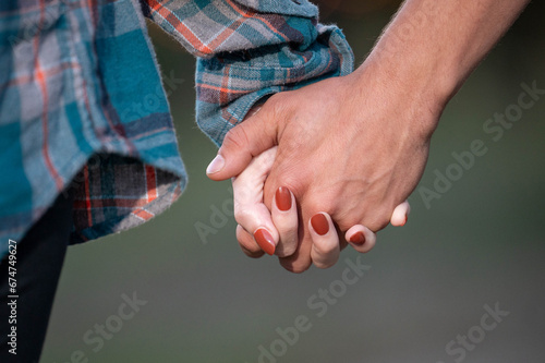 couple holding hands together