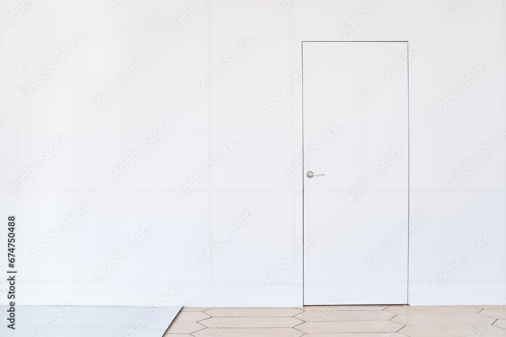 Wooden white door on a light background. Creative idea of a closed door, an entrance doorway isolated on a white background. White door design template.The concept of a closed house.High quality photo - obrazy, fototapety, plakaty 