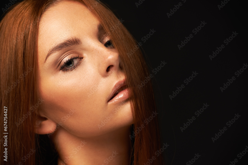 Obraz premium Hair care, portrait or woman with beauty space, skincare or results for glow, shine or collagen in studio. Black background, face or girl model with mockup for treatment, healthy texture or growth