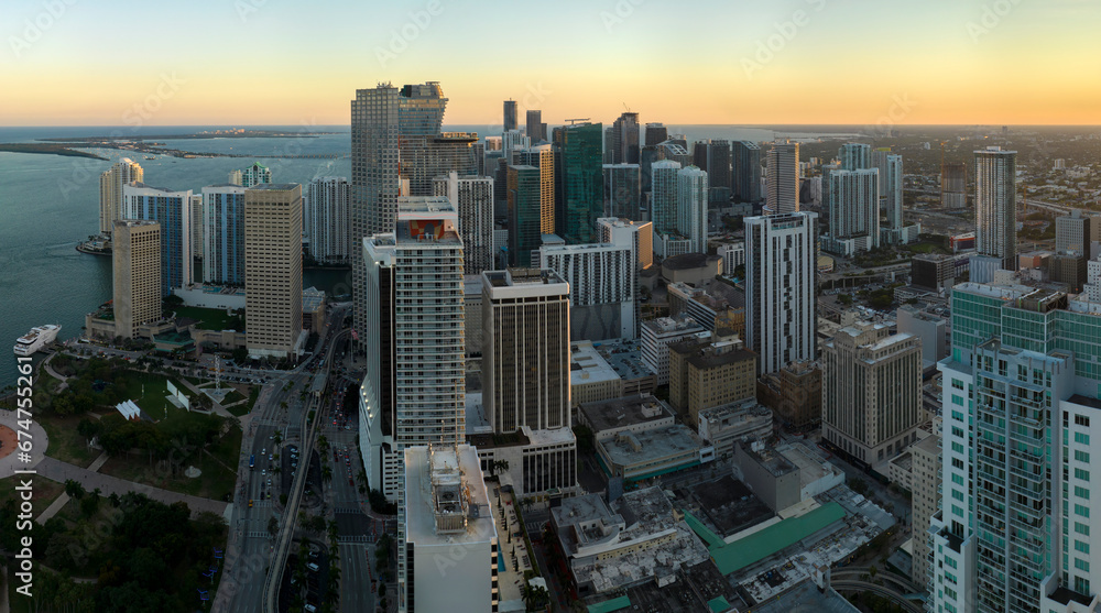 Aerial view of downtown district of of Miami Brickell in Florida, USA at sunset. High commercial and residential skyscraper buildings in modern american megapolis