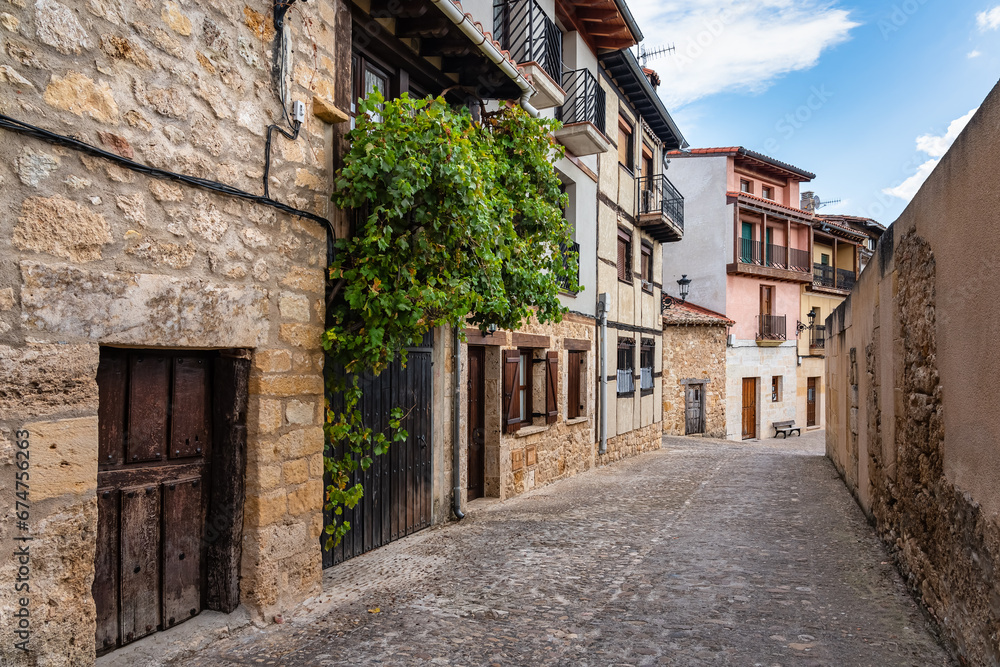 Alley of quaint-looking old stone houses in the medieval village of Frias, Burgos.