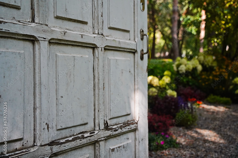 White wooden door in the garden area. White wooden door in the garden area.