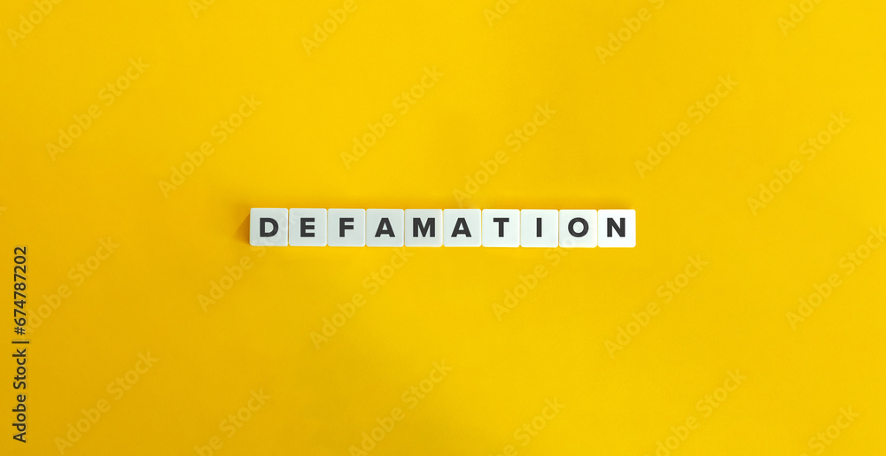 Defamation Word on Letter Tiles on Yellow Background.  - obrazy, fototapety, plakaty 