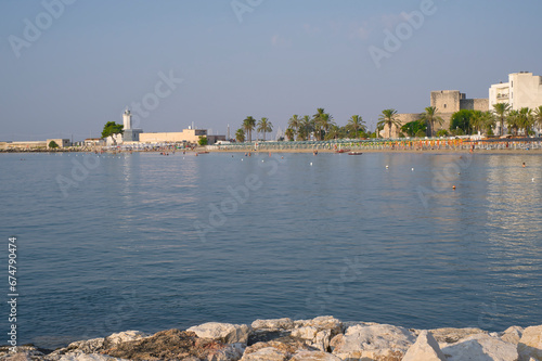 Fototapeta Naklejka Na Ścianę i Meble -  Wide view of the beach in Manfredonia town in front
Swabian castle, Puglia region in southern Italy