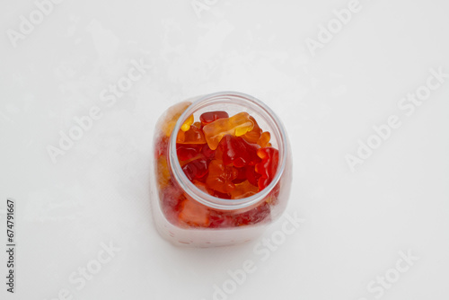 Fruity gummy bears in a glass jar. Top wiew
